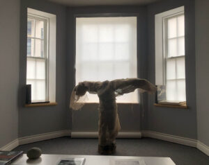 Sculpture by Adrian Symonds wrapped in burlap for this exhibit by d harris